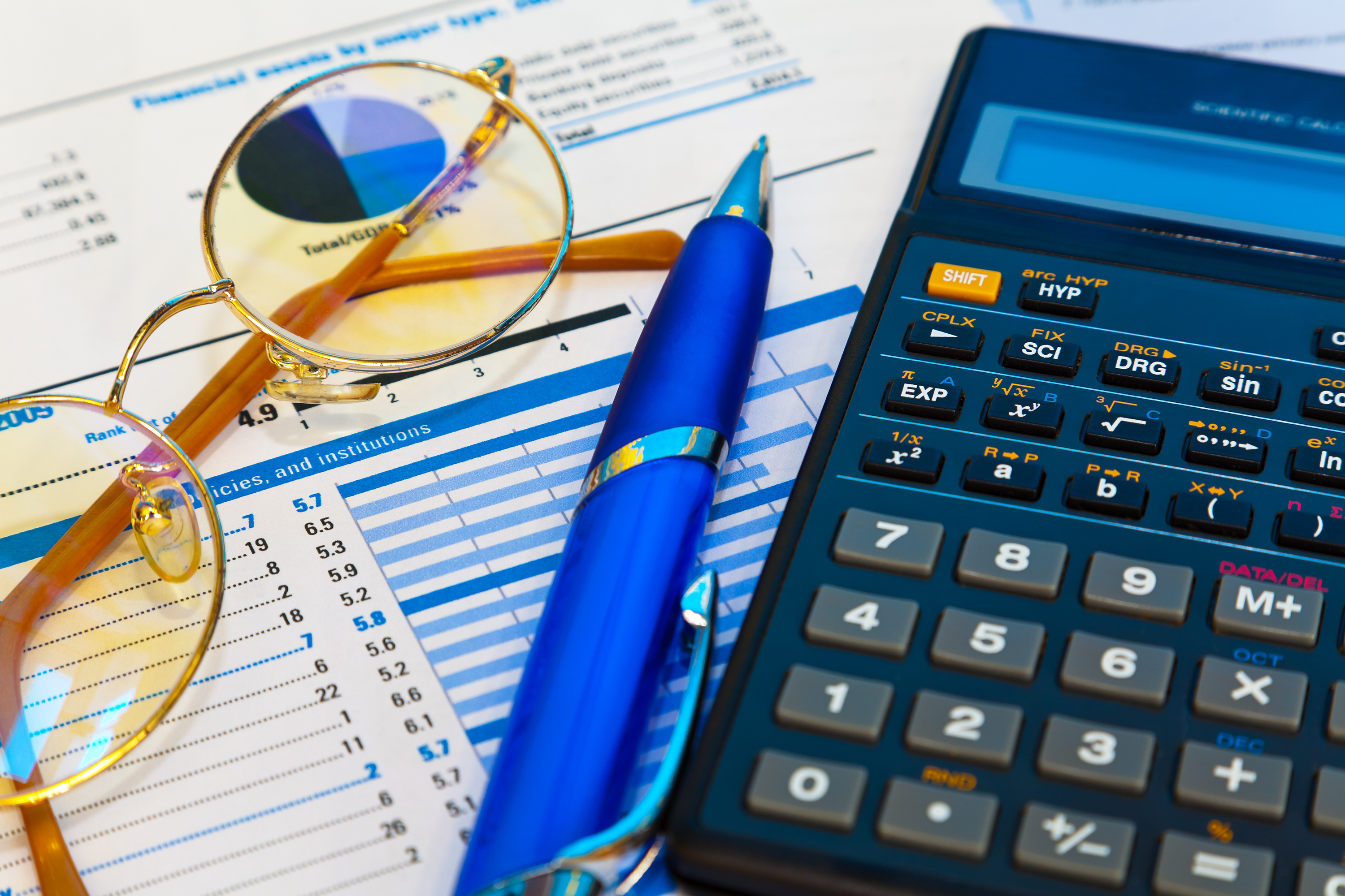 Accounting concept photo with calculator pen glasses 